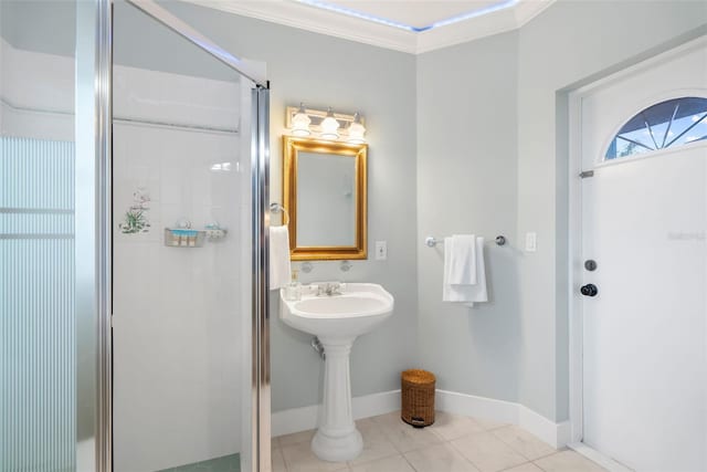 bathroom with tile patterned floors, an enclosed shower, and crown molding