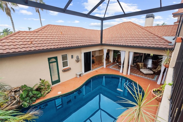 view of pool featuring a lanai