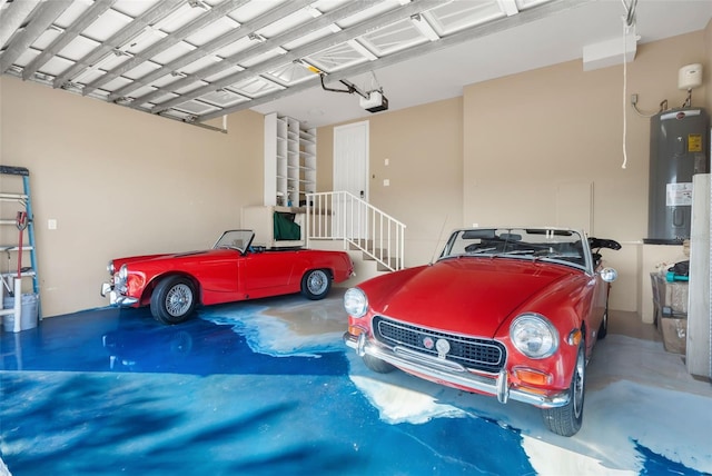 garage featuring water heater and a garage door opener