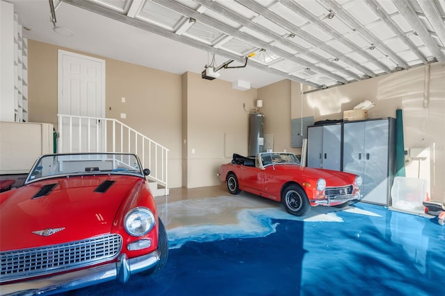 garage featuring electric water heater and a garage door opener