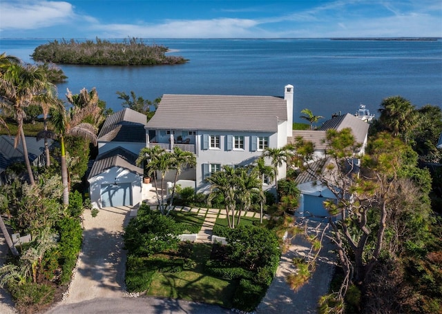 birds eye view of property with a water view