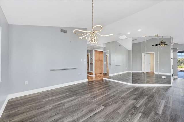 interior space featuring ceiling fan with notable chandelier, dark hardwood / wood-style floors, and high vaulted ceiling