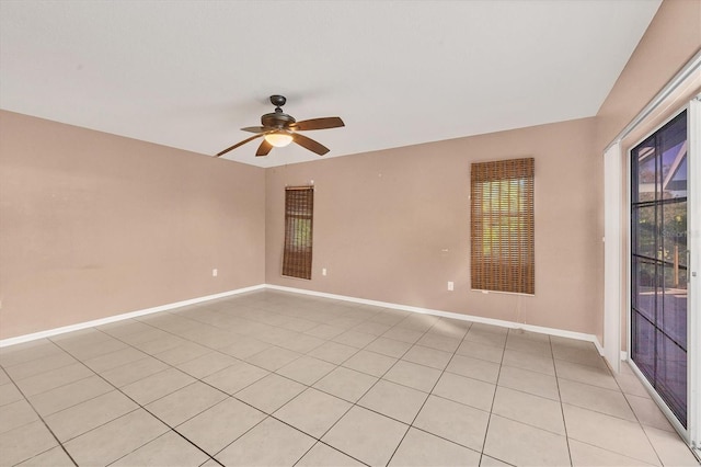 empty room with light tile patterned floors and ceiling fan