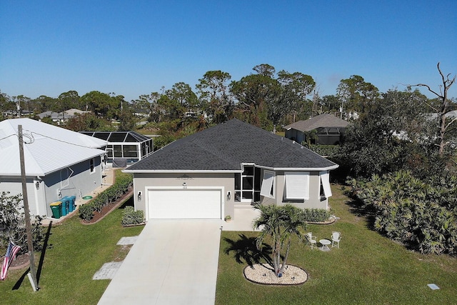 view of front facade with a front yard and a garage