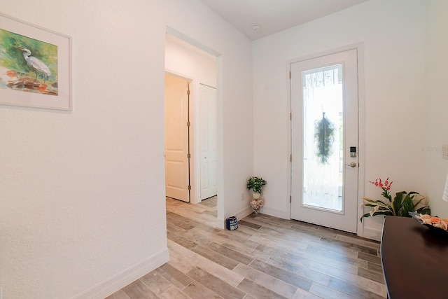 entryway with light hardwood / wood-style floors