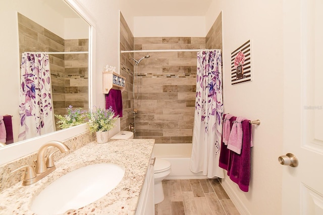 full bathroom featuring vanity, toilet, and shower / tub combo with curtain