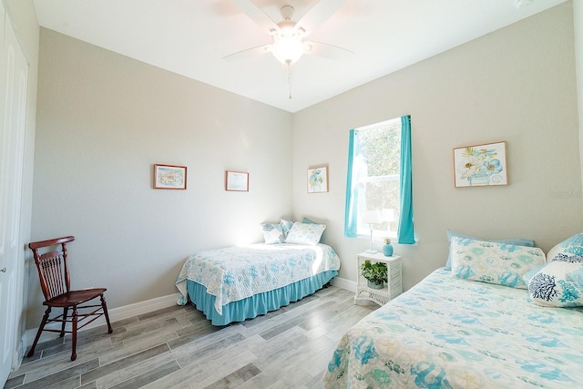 bedroom featuring hardwood / wood-style flooring and ceiling fan