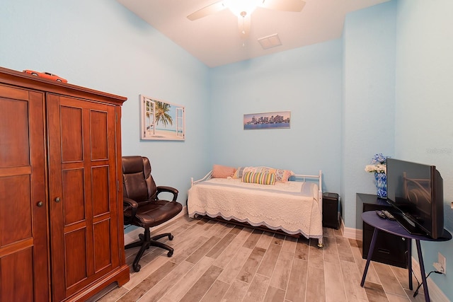 bedroom with ceiling fan and light wood-type flooring