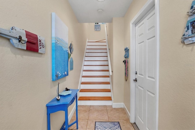 10390 Longshore Rd Unit 82, Placida, FL 33946 - staircase with tile patterned floors and baseboards