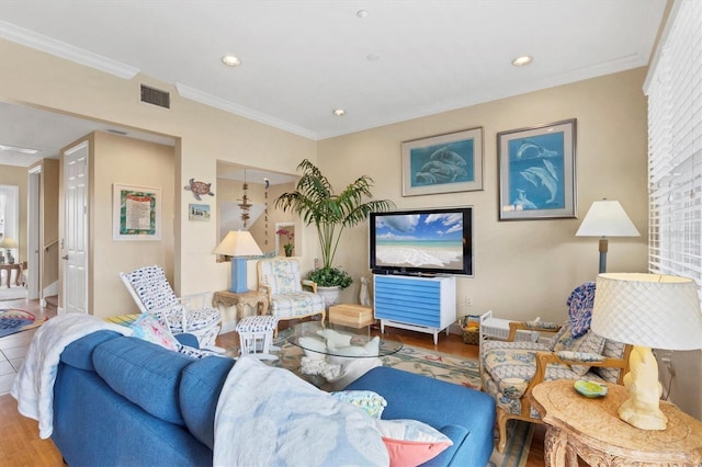 10390 Longshore Rd Unit 82, Placida, FL 33946 - living area featuring wood finished floors, ornamental molding, and recessed lighting