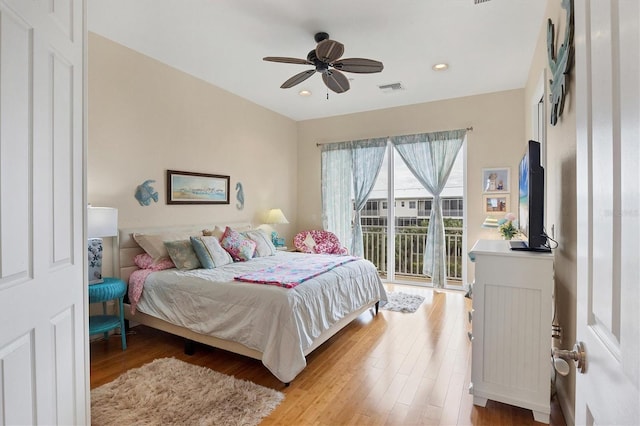 10390 Longshore Rd Unit 82, Placida, FL 33946 - bedroom with access to outside, light wood-type flooring, ceiling fan, and recessed lighting