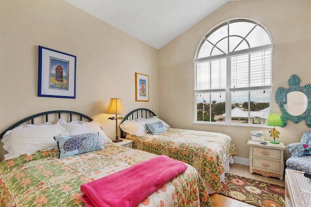 10390 Longshore Rd Unit 82, Placida, FL 33946 - bedroom with lofted ceiling and baseboards