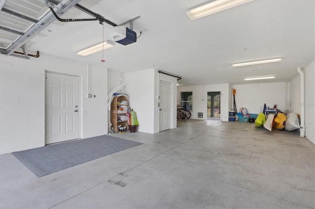 10390 Longshore Rd Unit 82, Placida, FL 33946 - garage featuring a garage door opener and french doors