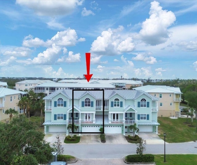 10390 Longshore Rd Unit 82, Placida, FL 33946 - view of building exterior featuring an attached garage and driveway