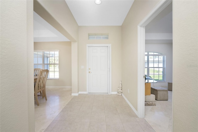 foyer featuring light tile patterned floors