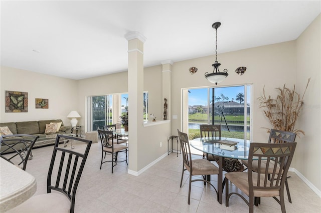 dining space with ornate columns and plenty of natural light