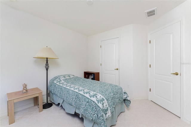 bedroom featuring light tile patterned floors