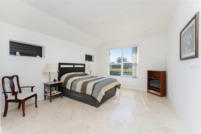 bedroom featuring lofted ceiling