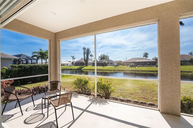 sunroom with a water view