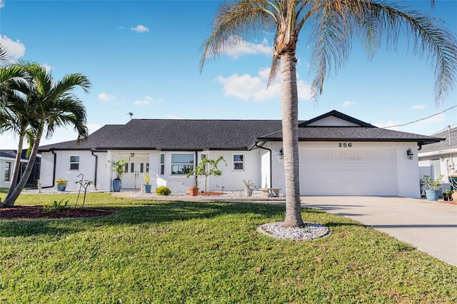 ranch-style home with a garage and a front lawn