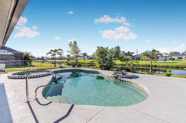 view of pool featuring a patio area and a water view