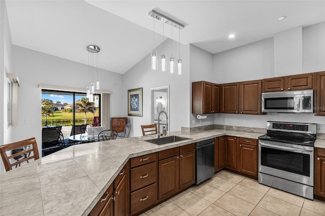 kitchen with stainless steel appliances, sink, light tile patterned floors, high vaulted ceiling, and hanging light fixtures