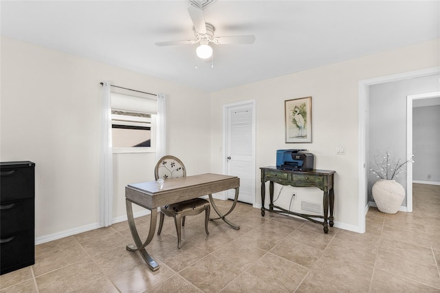 tiled home office featuring ceiling fan