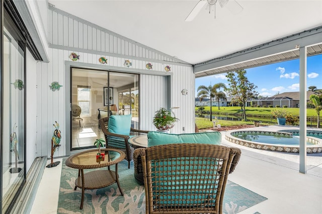 sunroom / solarium featuring ceiling fan and lofted ceiling