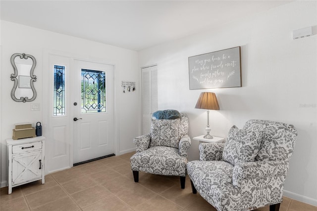 sitting room featuring light tile patterned flooring