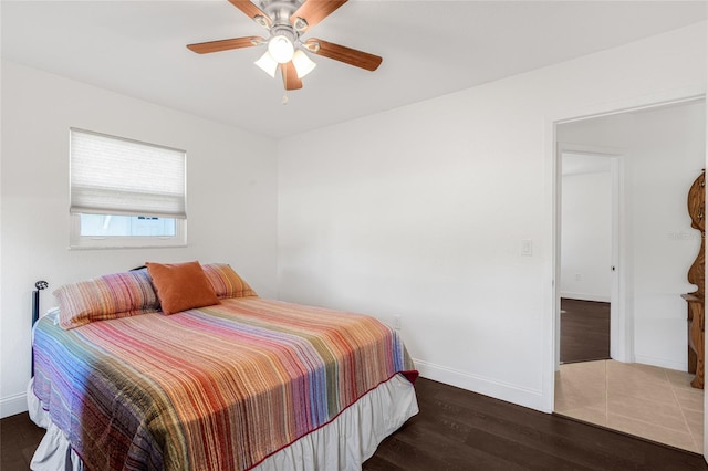 bedroom featuring ceiling fan and dark wood-type flooring