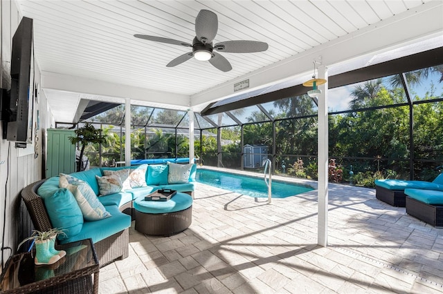 view of pool featuring a lanai, ceiling fan, a patio, and an outdoor hangout area