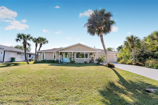 single story home with a garage and a front lawn