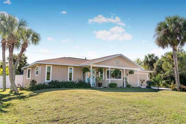 ranch-style house with a garage and a front lawn