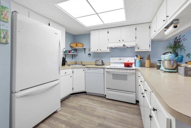 kitchen featuring a textured ceiling, white appliances, sink, light hardwood / wood-style floors, and white cabinetry