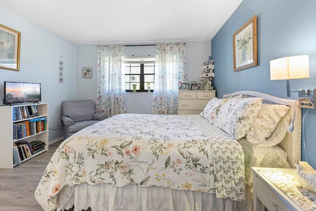 bedroom featuring hardwood / wood-style flooring