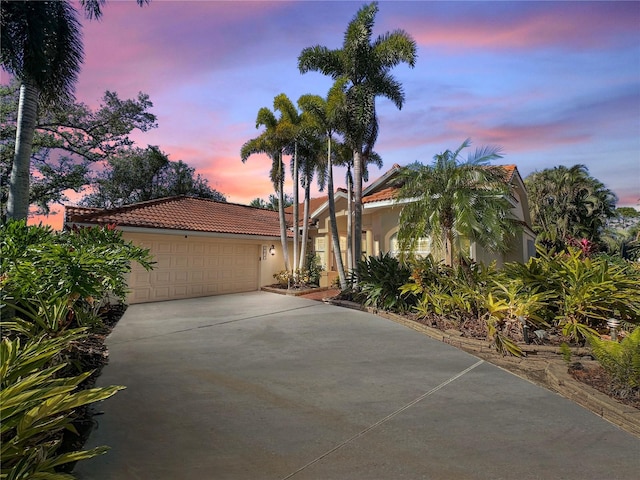 mediterranean / spanish-style home featuring a garage