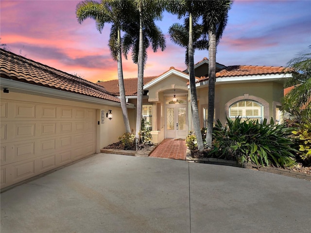 view of front of home featuring a garage and french doors