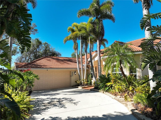 mediterranean / spanish-style house featuring a garage