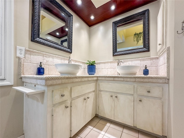 bathroom with tile patterned floors and vanity