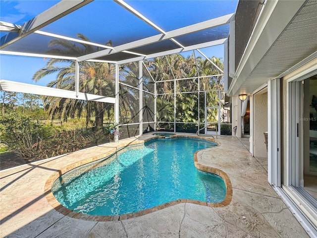 view of pool with a lanai and a patio