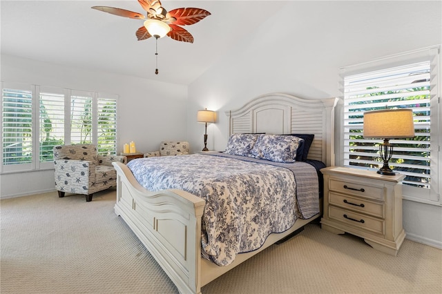 bedroom with vaulted ceiling, light carpet, and ceiling fan