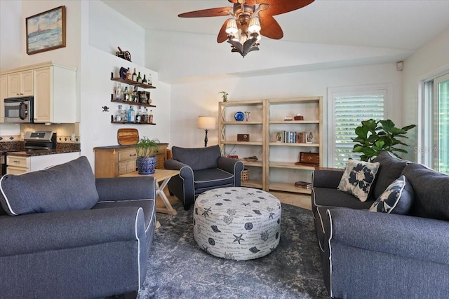 living room featuring lofted ceiling and ceiling fan