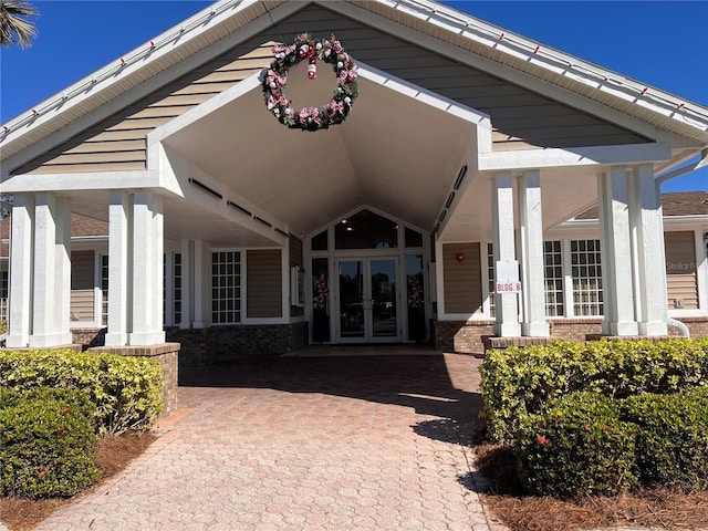 view of exterior entry featuring french doors