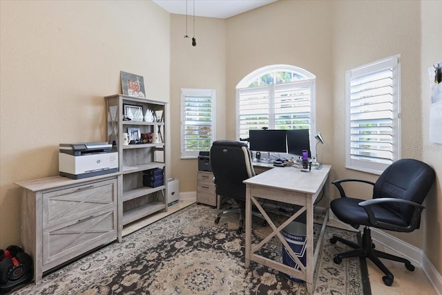 office featuring a high ceiling