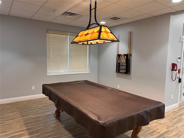 game room featuring wood-type flooring, pool table, and a drop ceiling