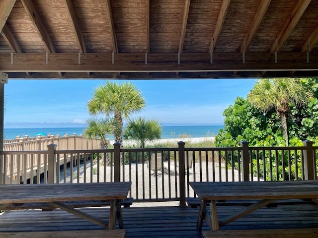 wooden deck featuring a water view