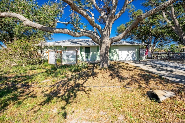 single story home with a garage