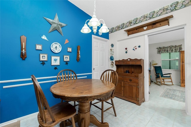 dining space featuring a notable chandelier