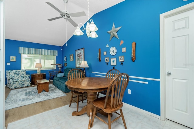 dining space with light hardwood / wood-style flooring, ceiling fan, and lofted ceiling