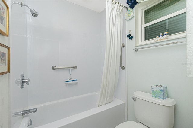 bathroom featuring shower / bath combination with curtain and toilet